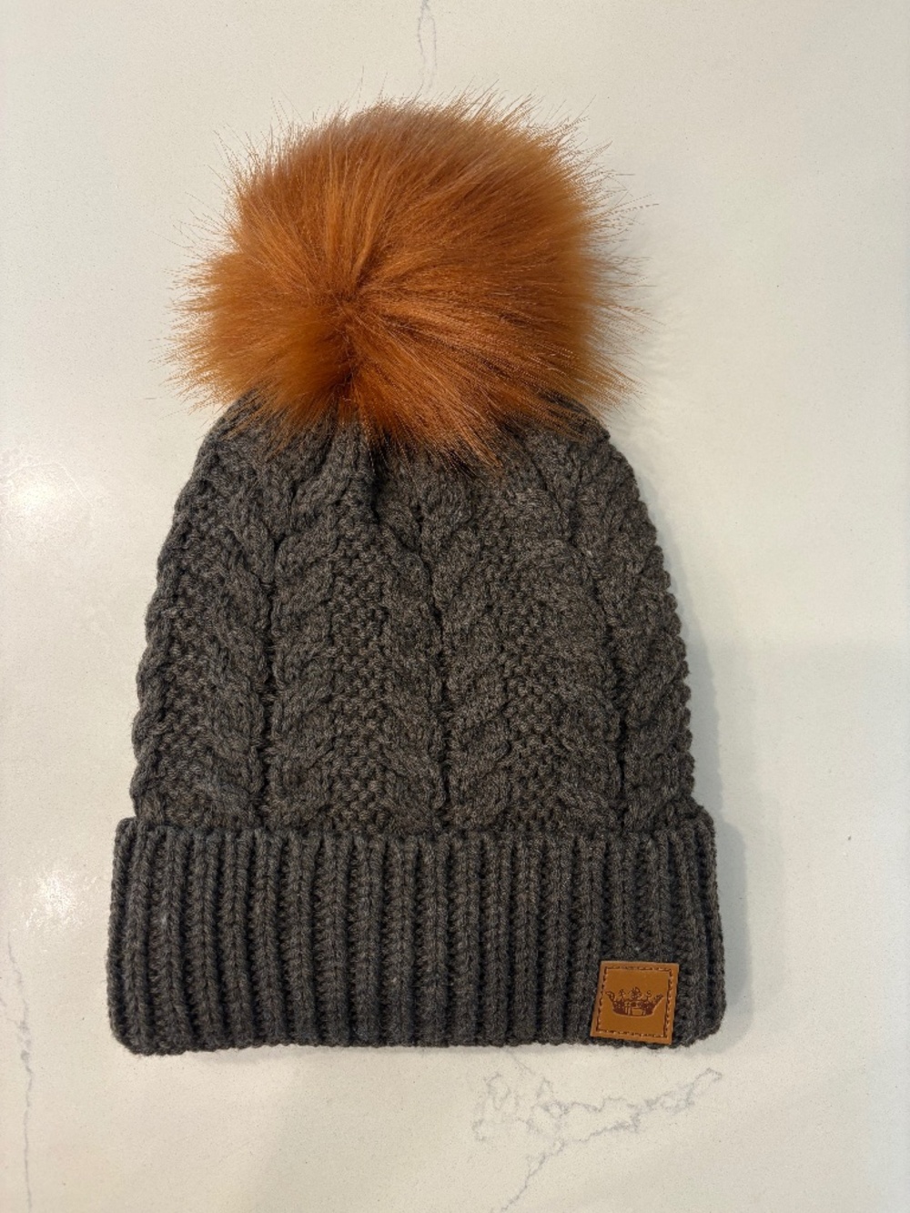 Panache Brown cable knit With Rust faux fur pom Beanie